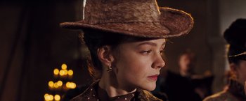 Movie still from “Far from the Madding Crowd” (2015), directed by Thomas Vinterberg – A person wearing a cowboy hat; Close Up shot, Over the shoulder angle