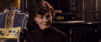 Movie still from “Far from the Madding Crowd” (2015), directed by Thomas Vinterberg – A young girl wearing a black shirt and gold earrings; Close Up shot, Over the shoulder angle