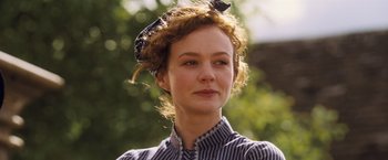 Movie still from “Far from the Madding Crowd” (2015), directed by Thomas Vinterberg – A woman with a bow in her hair; Close Up shot, Low angle