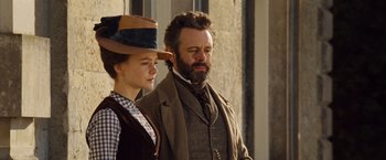 Movie still from “Far from the Madding Crowd” (2015), directed by Thomas Vinterberg – A man and a woman standing next to each other; Medium shot, Low angle