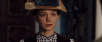 Movie still from “Far from the Madding Crowd” (2015), directed by Thomas Vinterberg – A person wearing a hat; Close Up shot, Over the shoulder angle