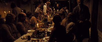 Movie still from “Far from the Madding Crowd” (2015), directed by Thomas Vinterberg – A group of people sitting around a dinner table; Wide shot, High angle