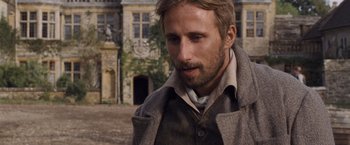 Movie still from “Far from the Madding Crowd” (2015), directed by Thomas Vinterberg – A person wearing a jacket; Close Up shot, Over the shoulder angle