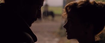 Movie still from “Far from the Madding Crowd” (2015), directed by Thomas Vinterberg – A man and a woman face to face in front of a horse; Close Up shot, Over the shoulder angle