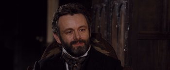 Movie still from “Far from the Madding Crowd” (2015), directed by Thomas Vinterberg – A person wearing a suit and tie; Close Up shot, High angle