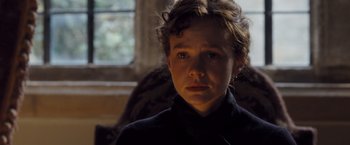 Movie still from “Far from the Madding Crowd” (2015), directed by Thomas Vinterberg – A young person is sitting in a chair; Close Up shot, Over the shoulder angle