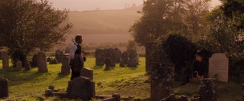 Movie still from “Far from the Madding Crowd” (2015), directed by Thomas Vinterberg – A man standing in front of an ancient stone circle; Wide shot, Over the shoulder angle