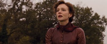 Movie still from “Far from the Madding Crowd” (2015), directed by Thomas Vinterberg – A woman wearing a brown leather jacket looking to her left; Close Up shot, Low angle