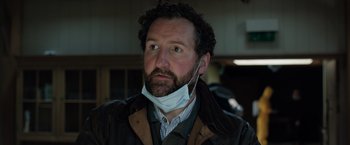 Movie still from “In the Earth” (2021), directed by Ben Wheatley – A person wearing a face mask; Close Up shot, Low angle