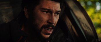 Movie still from “In the Earth” (2021), directed by Ben Wheatley – A person with a beard; Close Up shot, Over the shoulder angle