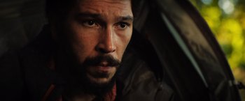 Movie still from “In the Earth” (2021), directed by Ben Wheatley – A person with a beard; Close Up shot, Low angle