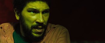 Movie still from “In the Earth” (2021), directed by Ben Wheatley – A person with a beard; Close Up shot, Low angle