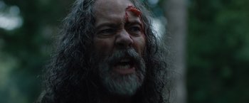 Movie still from “In the Earth” (2021), directed by Ben Wheatley – A person with a bloody nose; Close Up shot, Low angle