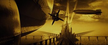 Movie still from “Independence Day: Resurgence” (2016), directed by Roland Emmerich – An airplane flying over a bridge with a city in the background; Extreme Wide shot, Low angle