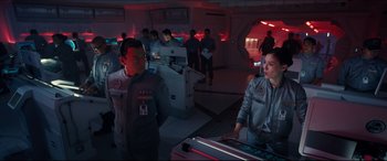 Movie still from “Independence Day: Resurgence” (2016), directed by Roland Emmerich – A group of people standing in a room; Medium shot, High angle