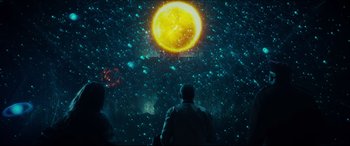 Movie still from “Independence Day: Resurgence” (2016), directed by Roland Emmerich – A man standing in front of a bright sun; Extreme Wide shot, Low angle