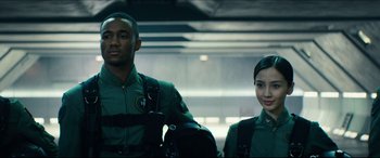 Movie still from “Independence Day: Resurgence” (2016), directed by Roland Emmerich – A man and a woman standing next to each other; Medium shot, Low angle