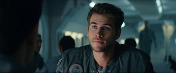 Movie still from “Independence Day: Resurgence” (2016), directed by Roland Emmerich – A person wearing a jacket; Close Up shot, Over the shoulder angle