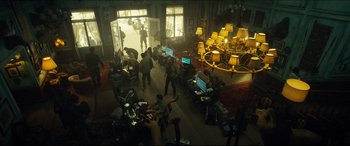 Movie still from “Independence Day: Resurgence” (2016), directed by Roland Emmerich – A group of people standing in a room with computers on top of them; Wide shot, High angle