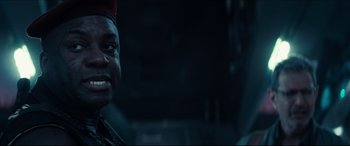 Movie still from “Independence Day: Resurgence” (2016), directed by Roland Emmerich – A person wearing a red hat; Close Up shot, Over the shoulder angle