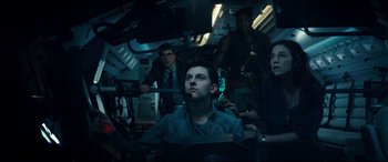 Movie still from “Independence Day: Resurgence” (2016), directed by Roland Emmerich – A group of people in a room with lights on; Medium shot, Low angle