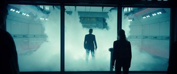 Movie still from “Independence Day: Resurgence” (2016), directed by Roland Emmerich – A man standing in front of a train window; Wide shot, Low angle