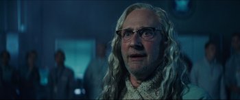 Movie still from “Independence Day: Resurgence” (2016), directed by Roland Emmerich – An old man with long white hair wearing glasses; Close Up shot, Over the shoulder angle