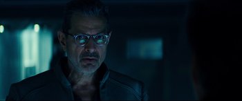 Movie still from “Independence Day: Resurgence” (2016), directed by Roland Emmerich – A person wearing glasses and a jacket; Close Up shot, Low angle