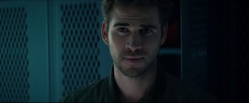 Movie still from “Independence Day: Resurgence” (2016), directed by Roland Emmerich – A person wearing a green shirt; Close Up shot, Over the shoulder angle