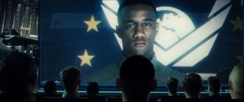 Movie still from “Independence Day: Resurgence” (2016), directed by Roland Emmerich – People watching a movie on a large screen; Close Up shot, Over the shoulder angle