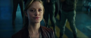 Movie still from “Independence Day: Resurgence” (2016), directed by Roland Emmerich – A beautiful young woman wearing a leather jacket; Close Up shot, Over the shoulder angle