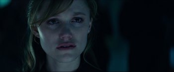 Movie still from “Independence Day: Resurgence” (2016), directed by Roland Emmerich – A woman's face in the dark; Close Up shot, Over the shoulder angle