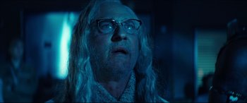 Movie still from “Independence Day: Resurgence” (2016), directed by Roland Emmerich – An old man with long white hair wearing glasses; Close Up shot, Low angle