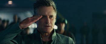 Movie still from “Independence Day: Resurgence” (2016), directed by Roland Emmerich – A man saluting while wearing an army uniform; Close Up shot, Low angle