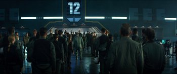 Movie still from “Independence Day: Resurgence” (2016), directed by Roland Emmerich – A group of people walking down a ramp; Wide shot, Over the shoulder angle