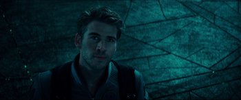 Movie still from “Independence Day: Resurgence” (2016), directed by Roland Emmerich – A person wearing a jacket; Close Up shot, Over the shoulder angle