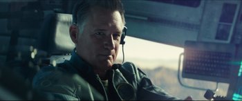 Movie still from “Independence Day: Resurgence” (2016), directed by Roland Emmerich – A person in a helicopter; Close Up shot, Low angle