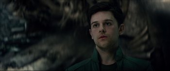 Movie still from “Independence Day: Resurgence” (2016), directed by Roland Emmerich – A young man in a green jacket looking to his left; Close Up shot, Low angle