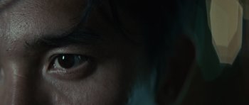 Movie still from “Infernal Affairs” (2002), directed by Alan Mak – A person's eye in the dark; Extreme Close Up shot, High angle