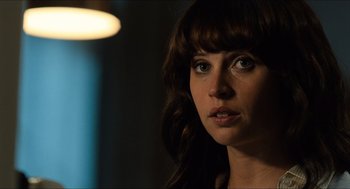 Movie still from “Inferno” (2016), directed by Ron Howard – A person looking at the camera; Close Up shot, Over the shoulder angle