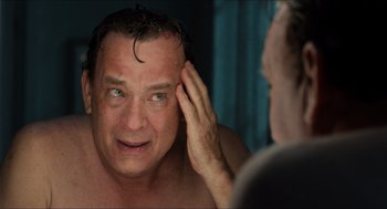 Movie still from “Inferno” (2016), directed by Ron Howard – A man looking at himself in the mirror; Close Up shot, Over the shoulder angle