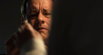 Movie still from “Inferno” (2016), directed by Ron Howard – A person with his eyes closed; Close Up shot, Over the shoulder angle