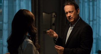 Movie still from “Inferno” (2016), directed by Ron Howard – A man and a woman are talking in a room; Close Up shot, Over the shoulder angle