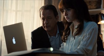 Movie still from “Inferno” (2016), directed by Ron Howard – A man and a woman looking at a computer screen; Medium shot, Over the shoulder angle
