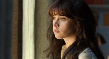 Movie still from “Inferno” (2016), directed by Ron Howard – A person looking out a window; Close Up shot, Low angle