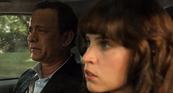 Movie still from “Inferno” (2016), directed by Ron Howard – A man and a woman sitting next to each other; Close Up shot, Over the shoulder angle