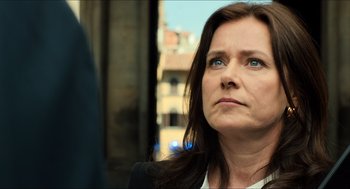 Movie still from “Inferno” (2016), directed by Ron Howard – A person with long dark hair; Close Up shot, Over the shoulder angle