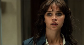 Movie still from “Inferno” (2016), directed by Ron Howard – A person wearing a jacket; Close Up shot, Over the shoulder angle