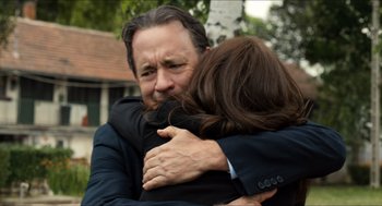 Movie still from “Inferno” (2016), directed by Ron Howard – A man and a woman hugging each other outside; Close Up shot, Over the shoulder angle