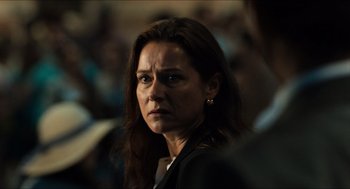 Movie still from “Inferno” (2016), directed by Ron Howard – A person wearing a jacket; Close Up shot, Over the shoulder angle
